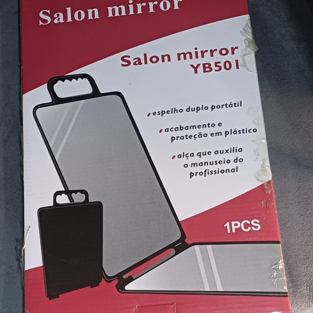 Double-sided rectangular handheld mirror with a book-style opening.