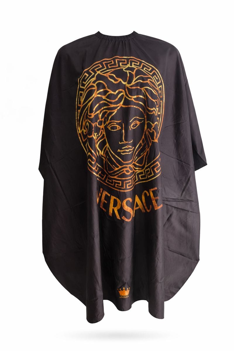 Black barber and salon gown with golden Versace-inspired design and full coverage.