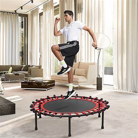1.3 metre round aerobic trampoline with handlebar on studio floor