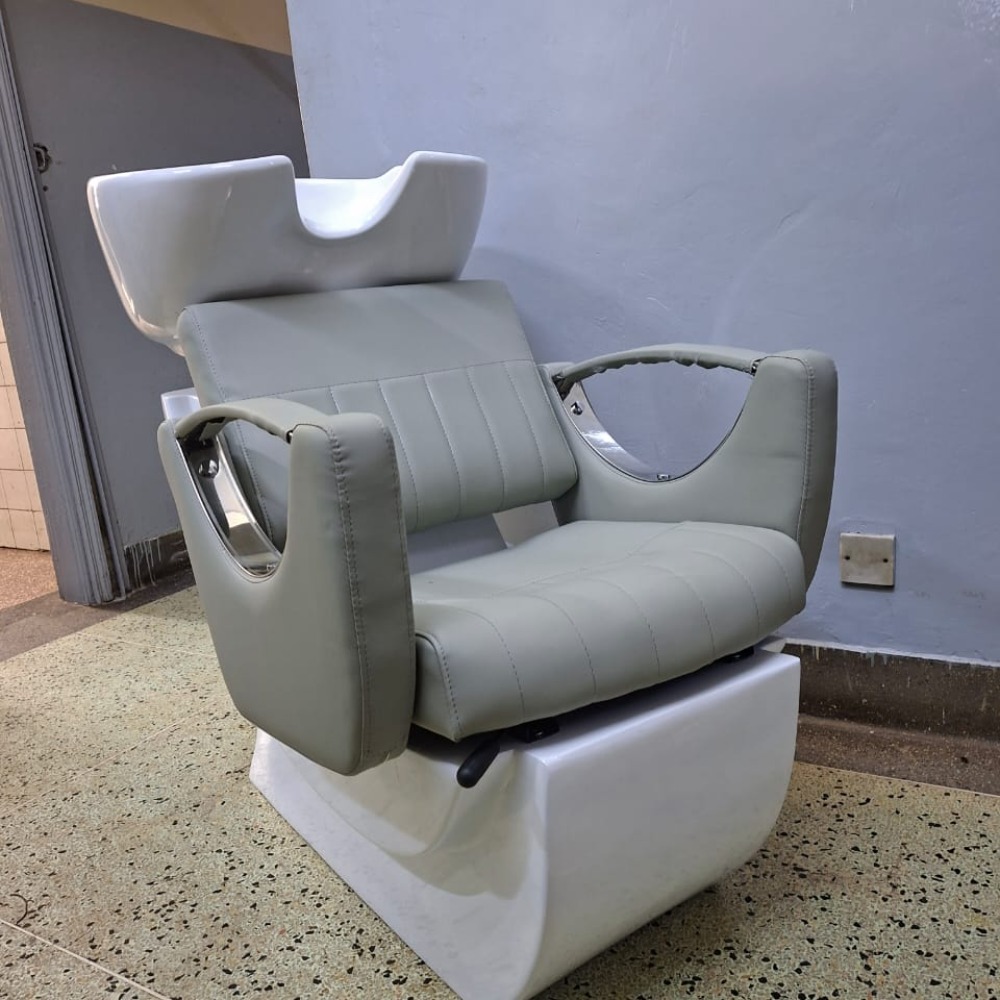 Shampoo sink unit in grey or black with white ceramic basin.