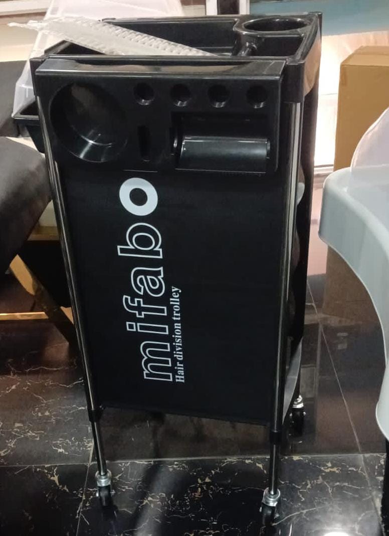 Black Mifabo salon trolley with tool holders and wheels.