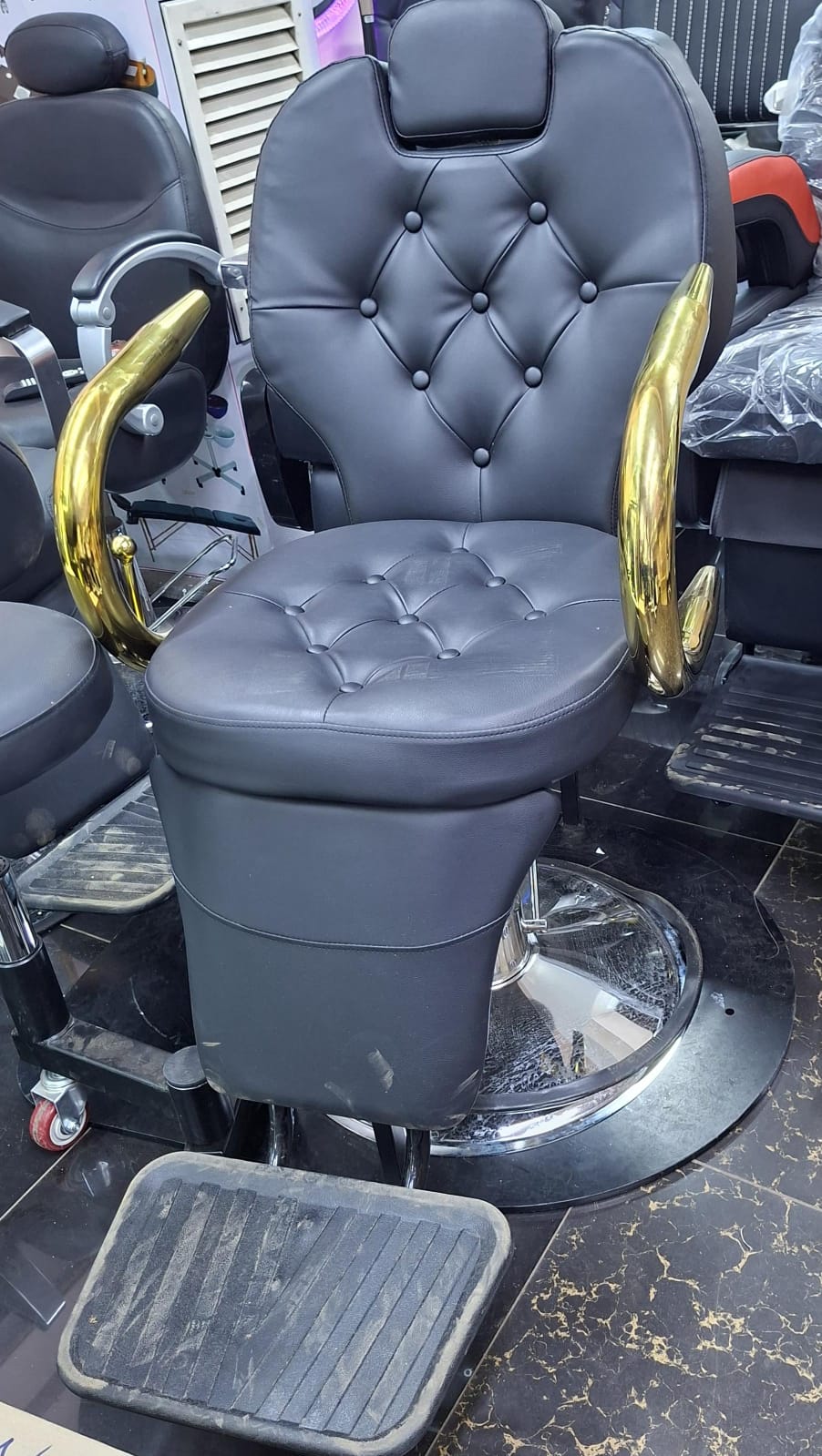 Barber chair gold chrome hands. 