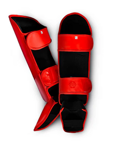 Black kickboxing shin guard with padded foot cover