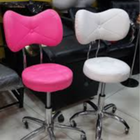 Adjustable stool with butterfly backrest, featuring a hydraulic lift, 360-degree swivel, and ergonomic design for comfort and support, ideal for salons, barbershops, and spas.