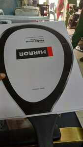 Curved handheld mirror